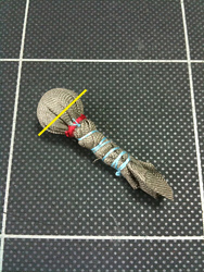 てるてる坊主の胴体をねじって細くし縛ってしまいます